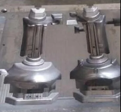 Twin machined mould cavities in a steel block
